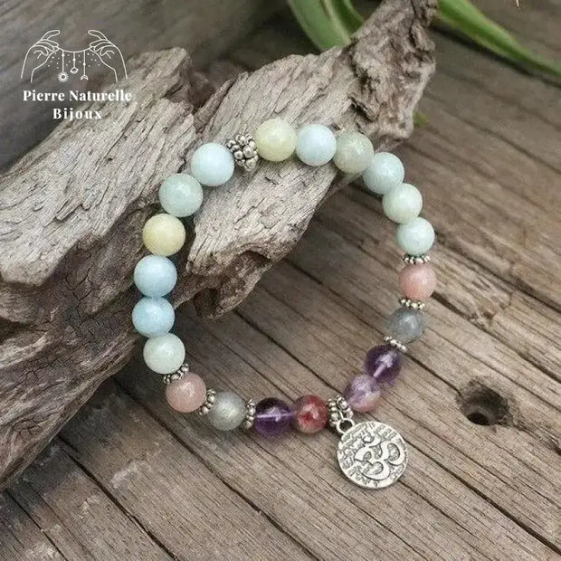 Bracelet charm "Création" en Aigue-marine, Améthyste, Pierre de soleil et Labradorite charm om