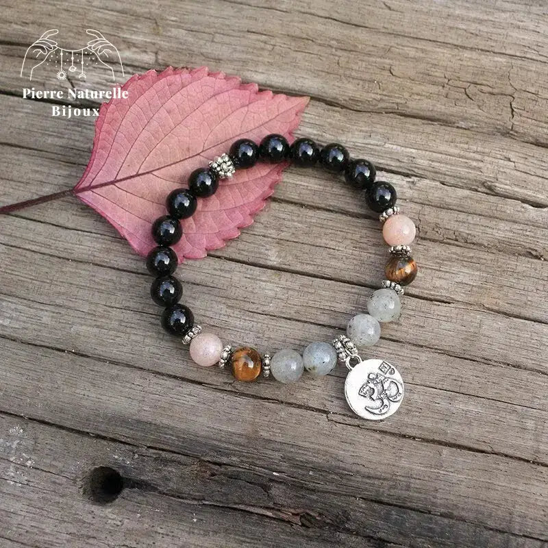 Bracelet charm om "Solaire" en Onyx, Pierre de soleil, œil de tigre et Labradorite