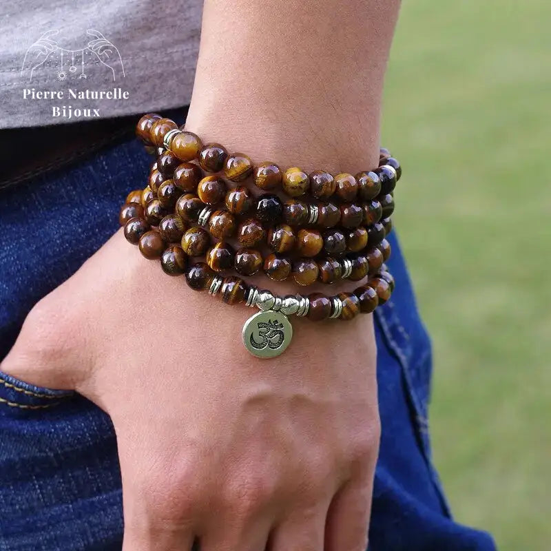 Bracelet mala œil de tigre avec charm Lotus / Om