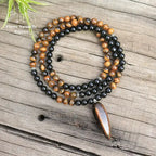 Collier "Absorption" en œil de tigre et Onyx | Colliers | pierre naturelle bijoux