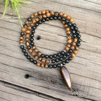 Collier "Absorption" en œil de tigre et Onyx | Colliers | pierre naturelle bijoux